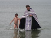 Крещение участника летнего лагеря